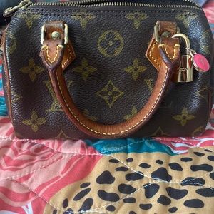 Authentic mini speedy Louis Vuitton with lock and key and pink LV charm